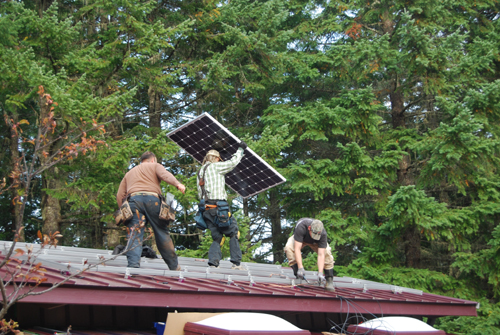 The solar panels go up